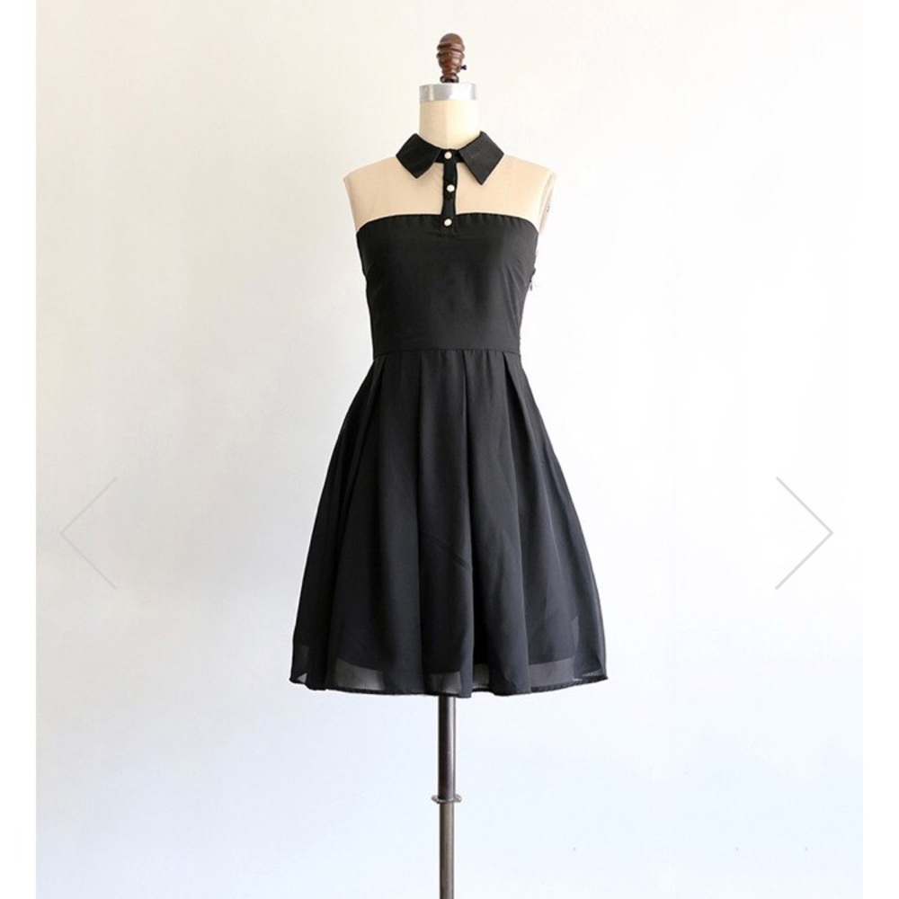 Knee-length sleeveless LBD with sheer detail!